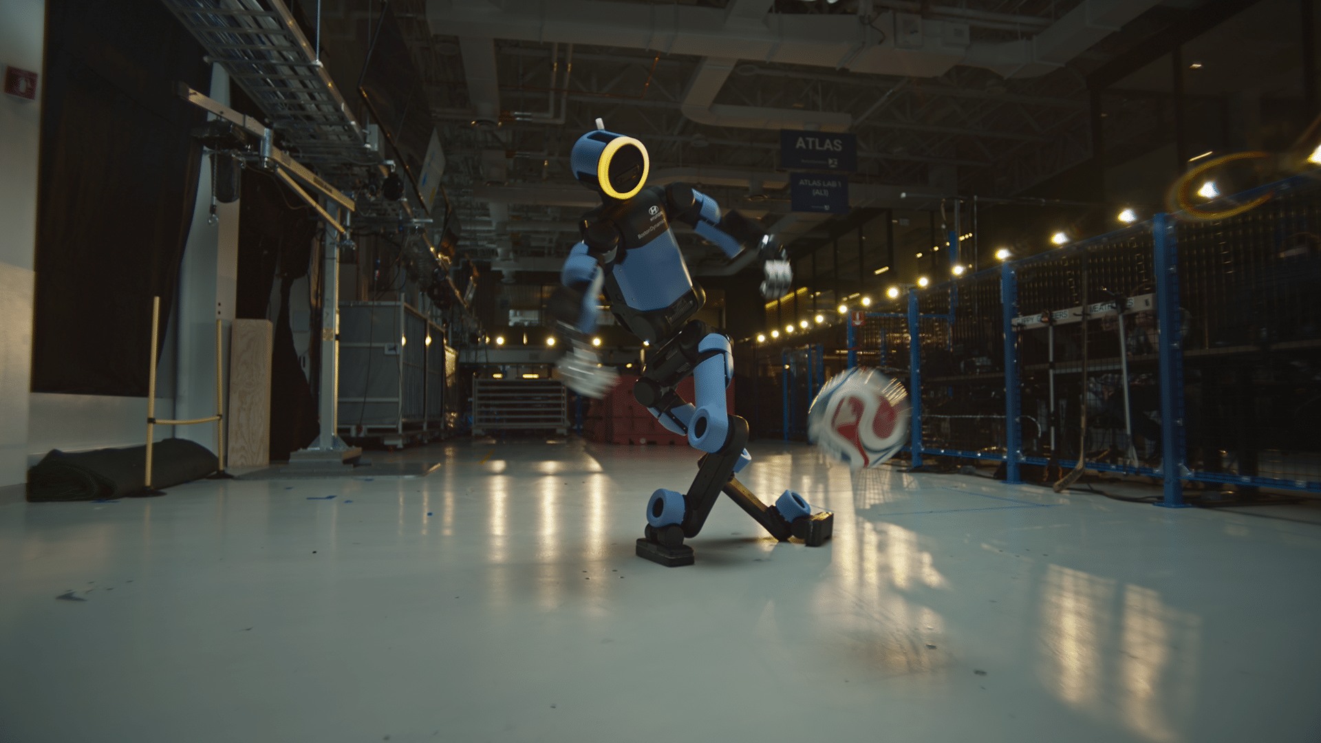 Atlas humanoid making a football trick shot in a Boston Dynamics demonstration