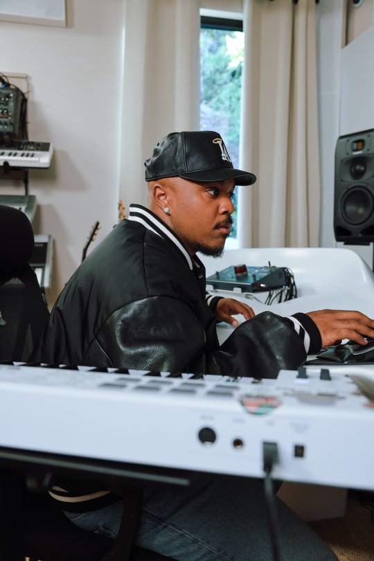 Music producer Khris Riddick-Tynes working at a studio desk, from Google’s Flow Music announcement.