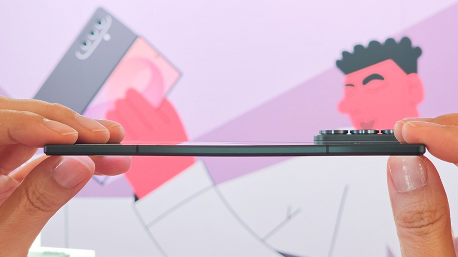 Samsung foldable held edge-on between two hands