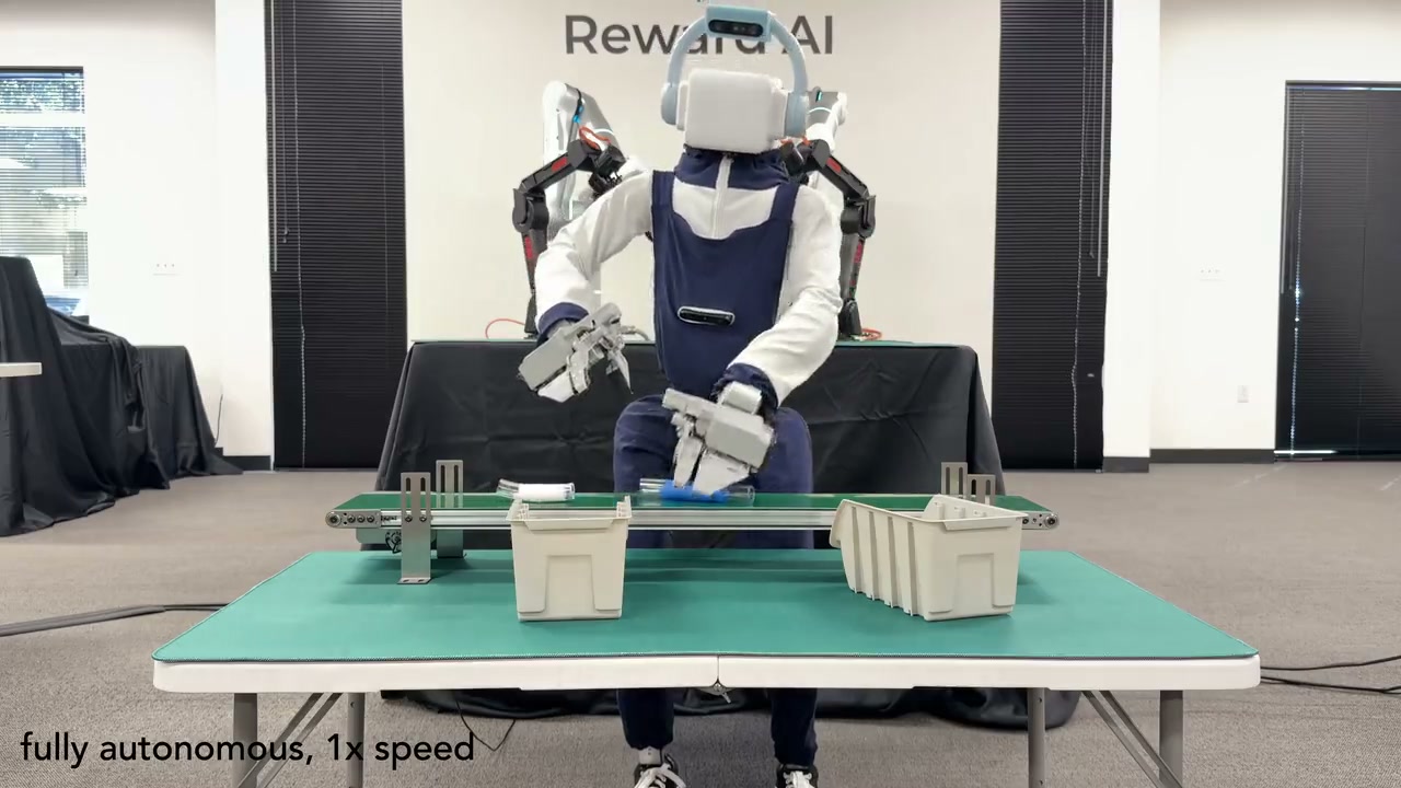 A humanoid manipulates objects between containers in Reward AI’s cross-embodiment demonstration.